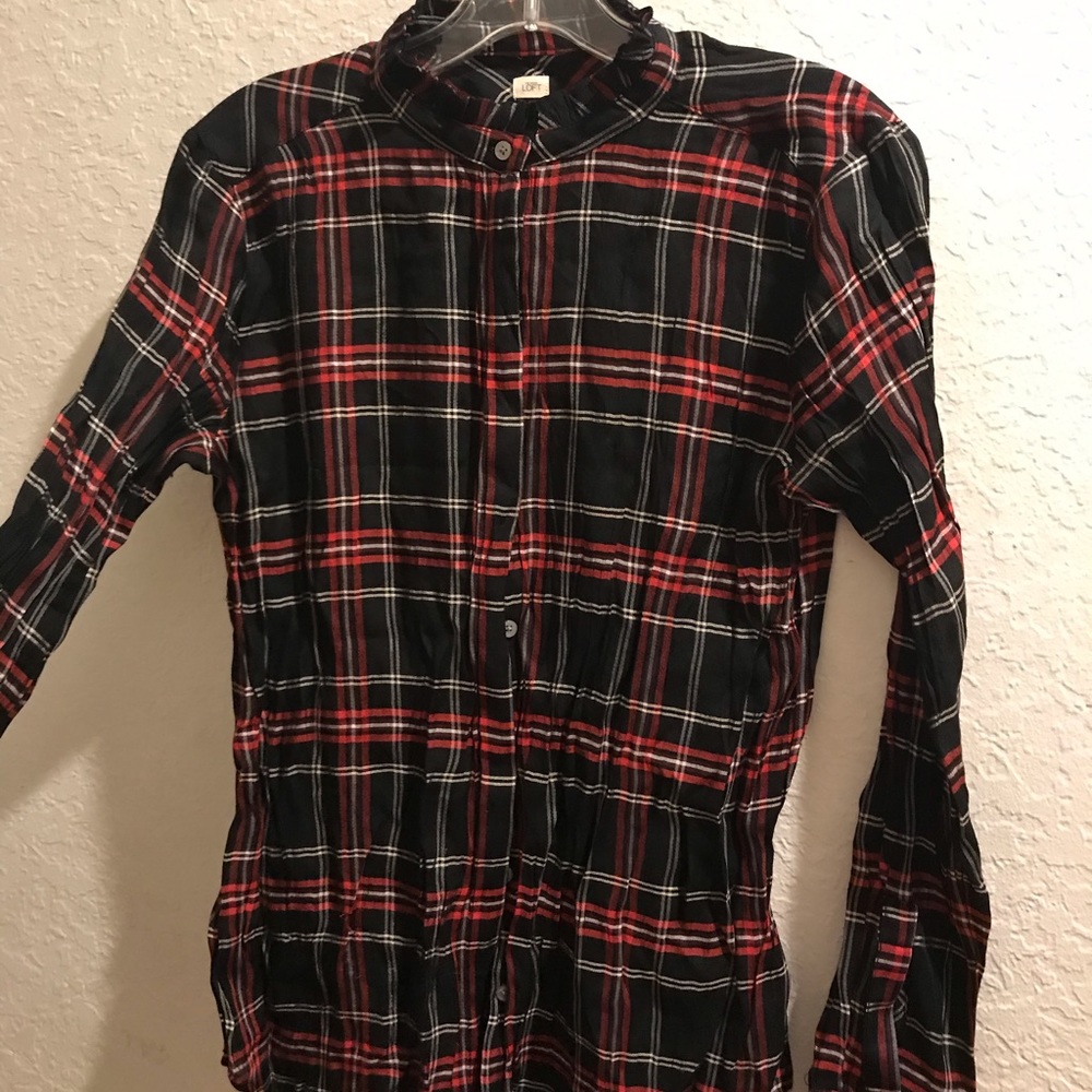 Black and red long sleeve with ruffled collar.